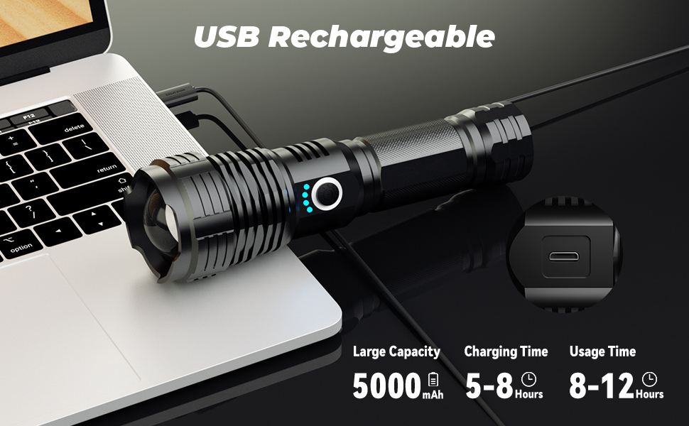 A black flashlight lies on a dark surface, plugged into the side of a laptop for charging. The image is titled "USB Rechargeable" and features a circular inset showing a close-up of the micro-USB charging port and specifies a 5000mAh large capacity, a 5–8 hour charging time, and an 8–12 hour usage time.