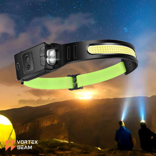 the Vortex Beam headlamp, featuring a close-up of the black and neon green device floating over a scenic mountain landscape at dusk. In the background, two people wearing headlamps sit on a ridge under a starry sky, with the Vortex Beam logo in the bottom corner.